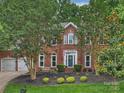 Charming two-story brick home with a well-manicured front yard and inviting curb appeal at 314 Southern Cross Ln, Matthews, NC 28105