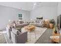 Spacious living room featuring neutral walls, stylish furniture, and natural light at 4122 Munson Dr, Charlotte, NC 28215
