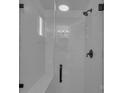A glass-enclosed shower featuring white subway tile, a built-in bench, and black hardware at 4315 Gibbon Rd, Charlotte, NC 28269