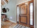 Stunning front entrance with hardwood floors, decorative door, and views into the living space at 4681 Dove Point Ln, York, SC 29745