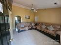 Cozy living room featuring comfortable seating, tile floors, and neutral walls at 501 N Johnson St, Monroe, NC 28112