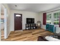 Cozy living room with new floors, large windows, and a comfortable seating area at 6206 Clearwater Dr, Indian Trail, NC 28079