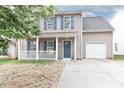 Charming two-story home with blue shutters and a covered front porch at 7806 Mcgarry Trl, Charlotte, NC 28214
