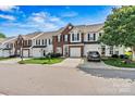 View of the townhome community, showcasing well-kept properties and attractive landscaping at 8002 Mariners Pointe Cir, Denver, NC 28037