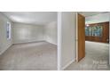 Spacious, carpeted bedroom with ample natural light, freshly painted neutral walls at 967 Hilldale Dr, Lancaster, SC 29720
