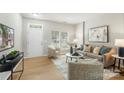 Inviting living room with neutral tones, stylish decor, and abundant natural light at 10225 Alexander Martin Ave, Charlotte, NC 28277