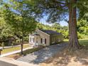 Inviting single-story home featuring a gravel driveway and a classic, cozy appearance at 103 Garfield Ave, Albemarle, NC 28001