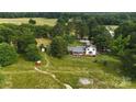 A bird's eye view of the property showcasing the home, surrounding land, and outbuildings at 1238 Carl Allen Rd, Edgemoor, SC 29712