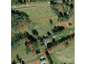 Aerial view of 6-acre property including home with mature trees and surrounding land at 1238 Carl Allen Rd, Edgemoor, SC 29712