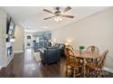 Open living space with hardwood floors, a ceiling fan, and a view into the kitchen at 1925 Sandal Brook Rd, Indian Land, SC 29707