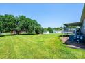 Expansive backyard with mature trees, a covered deck, offering ample outdoor living space at 2031 36Th Ne St, Hickory, NC 28601