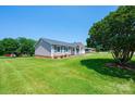A charming one-story home with a well-kept lawn and tidy landscaping at 2031 36Th Ne St, Hickory, NC 28601