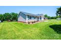 A quaint one-story home exhibiting lush green lawn and tidy landscaping at 2031 36Th Ne St, Hickory, NC 28601
