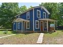 Inviting two-story home with a covered porch and nicely maintained front yard at 2131 E Nc 10 Hwy, Conover, NC 28613