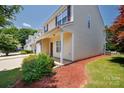 Townhome's side exterior features light siding, mulch, and a small bush at 2180 Shady Pond Dr, Clover, SC 29710