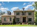 Beautiful brick two-story home with manicured lawn and inviting front entrance at 4005 Capullo Ct, Matthews, NC 28104