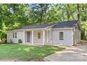 Well-maintained single Gathering home with a combination of brick and siding, complemented by a freshly cut lawn at 4410 Burgin St, Kannapolis, NC 28081