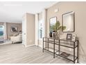 Inviting entryway with glass console table and mirrors, leading into a sunlit living space at 4689 Fanning Rd, Hickory, NC 28602