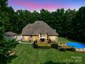 Spacious backyard featuring a deck, patio, and inviting above ground pool with plenty of room for entertaining at 8101 Cane Pointe Ln, Waxhaw, NC 28173
