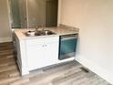 Efficient kitchen island with stainless steel sink, dishwasher, and sleek countertops at 1012 4Th St, Statesville, NC 28677