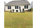 A well maintained backyard patio area with ample yard space at 110 White Apple Way, Statesville, NC 28625