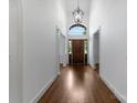 Bright foyer with hardwood floors, soaring ceilings, arched window, and grand entrance at 1108 Shinnecock Ln, Waxhaw, NC 28173