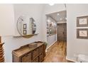 Hallway entry area featuring wood floors and a decorative shelf at 1172 Queens Rd, Charlotte, NC 28207