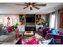 Bright living room featuring a fireplace, custom built-ins, and stylish furnishings at 12150 Plover Dr, Charlotte, NC 28269