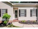 Inviting front entrance with a well-maintained yard and classic exterior details at 146 Valley Glen Dr, Troutman, NC 28166