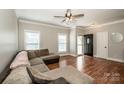 Bright living room with hardwood floors, neutral walls, and a comfortable seating area at 146 Valley Glen Dr, Troutman, NC 28166
