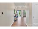 Warm entryway boasting wood floors and a glimpse into adjacent rooms enhancing the home's spacious feel at 14734 Rivergate Pkwy, Charlotte, NC 28273