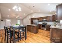 Beautiful kitchen with an island, stainless appliances, wood cabinets, and a dining table at 201 S 5Th Ave, Maiden, NC 28650
