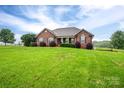 Beautiful brick home with a well-kept lawn and mature trees offers privacy at 2817 Long Cir # 1, Iron Station, NC 28080
