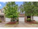 Attractive two-story townhome with a brick facade and a one-car garage at 3237 Yarmouth Ln, Gastonia, NC 28056