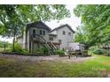 Back of house featuring a deck, stairs, a grilling area and wooden privacy fence at 40 Old Rd, Taylorsville, NC 28681