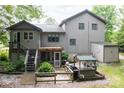 Back of house featuring a deck, stairs, a grilling area and shed at 40 Old Rd, Taylorsville, NC 28681
