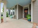 Inviting front porch with seating and stylish decor leading to the home's entrance at 4305 Twenty Grand Dr, Indian Trail, NC 28079
