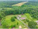 Expansive aerial view of a home surrounded by lush forest and greenery at 4373 Wentz Rd, Maiden, NC 28650