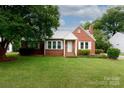 Charming brick home featuring a well-manicured lawn and bright white trim at 761 Milton Ave, Rock Hill, SC 29730