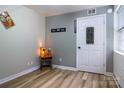 Neutral bedroom features wood floors, modern decor, and natural light from the window at 1028 Washburn Switch Rd, Shelby, NC 28150