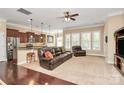 Living space with hardwood floors, a modern kitchen, and a cozy living room area at 1397 Tupelo Rd, Clover, SC 29710