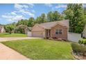 Beautiful home with manicured lawn, showcasing the side of the property and the well-kept garden at 146 Pheasant Ridge Cir, York, SC 29745