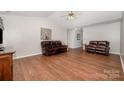 Spacious living room with hardwood floors, neutral walls and comfortable leather seating at 146 Pheasant Ridge Cir, York, SC 29745