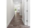 Hallway featuring wood-look flooring and light walls, providing a clean and inviting space at 1651 Carolina Cir, Gastonia, NC 28054