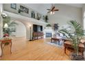 Spacious living room with hardwood floors, a fireplace, and high ceilings, perfect for entertaining at 2132 Cubla Ct, Rock Hill, SC 29732