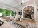 Bright living room featuring stone fireplace, large windows, and recessed lighting at 3394 Rainbow Dr, Waxhaw, NC 28173