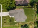 Overhead view of a well-kept home with garden beds and a fully fenced backyard at 3633 Longpond Ln, Monroe, NC 28110