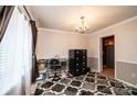 Office space with black filing cabinet, chandelier lighting, and neutral-toned walls at 5516 Northwood Dr, Hickory, NC 28601