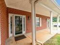 Clean brick building featuring a front door and lots of light at 7012 Somerset Springs Dr # E, Charlotte, NC 28262