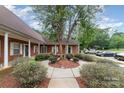 Well-maintained brick building with landscaped grounds and ample parking space at 7012 Somerset Springs Dr # E, Charlotte, NC 28262